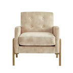 Poltrona moderna ed elegante con schienale trapuntato, rivestita in tessuto e con struttura in legno massello, ideale per il relax e la lettura in salotto