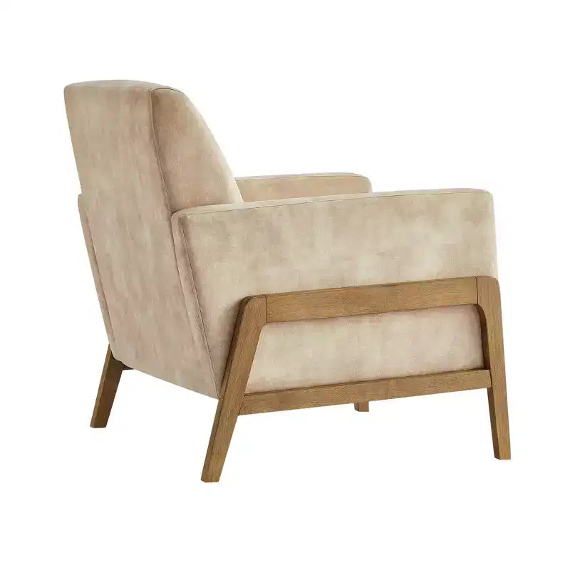 Poltrona moderna ed elegante con schienale trapuntato, rivestita in tessuto e con struttura in legno massello, ideale per il relax e la lettura in salotto