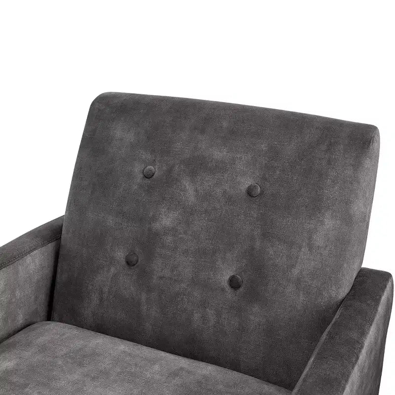 Poltrona moderna ed elegante con schienale trapuntato, rivestita in tessuto e con struttura in legno massello, ideale per il relax e la lettura in salotto